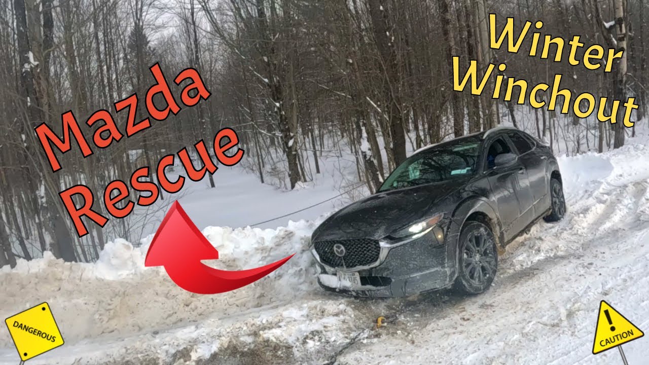 Winching out a Mazda in a Winter Snowstorm!!!