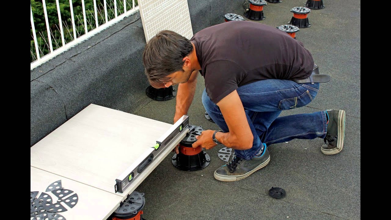 Flat roof terrace with porcelain tiles on pedestals - AlfrescoFloors.co.uk