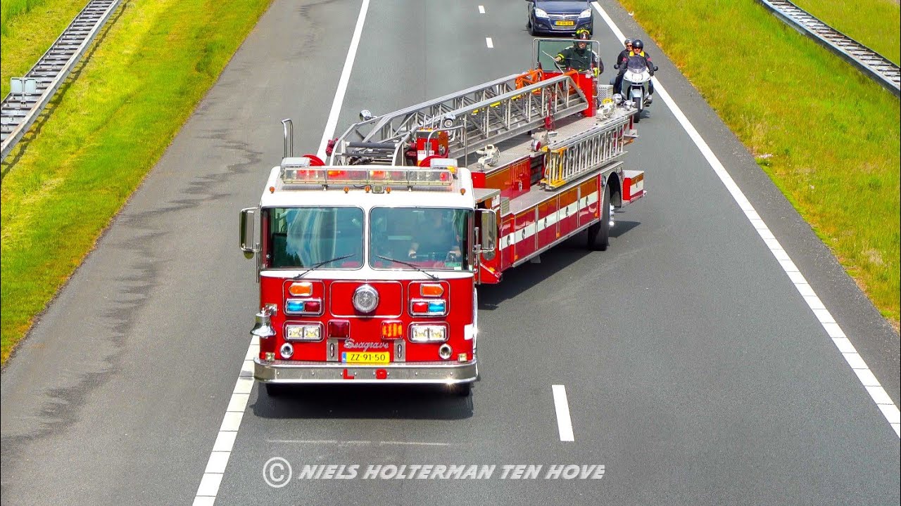 Tiller fire truck drifting on dutch highway with lights and siren