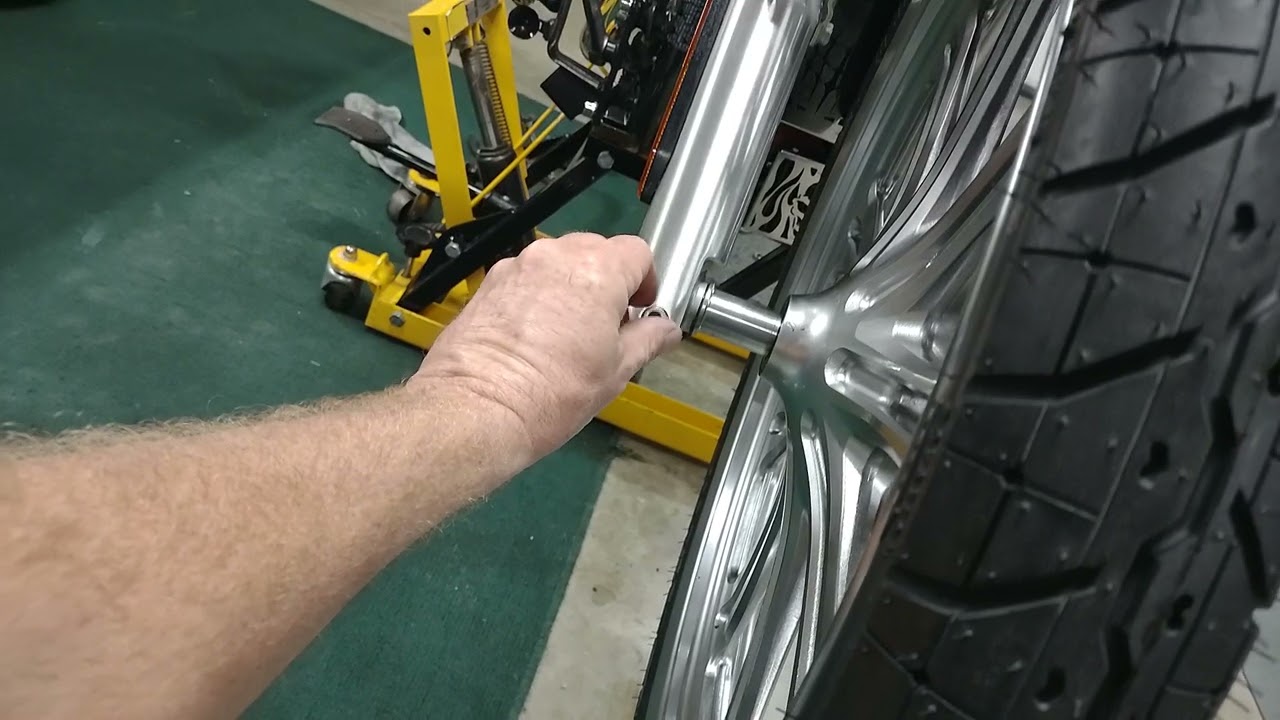 greasing motorcycle wheel bearing and installing the front wheel on a Kawasaki Vulcan custom 900