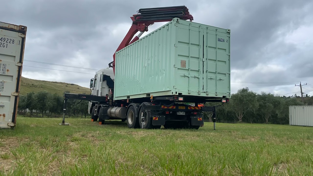Red Tow's Crane Truck unloading 20ft Container.