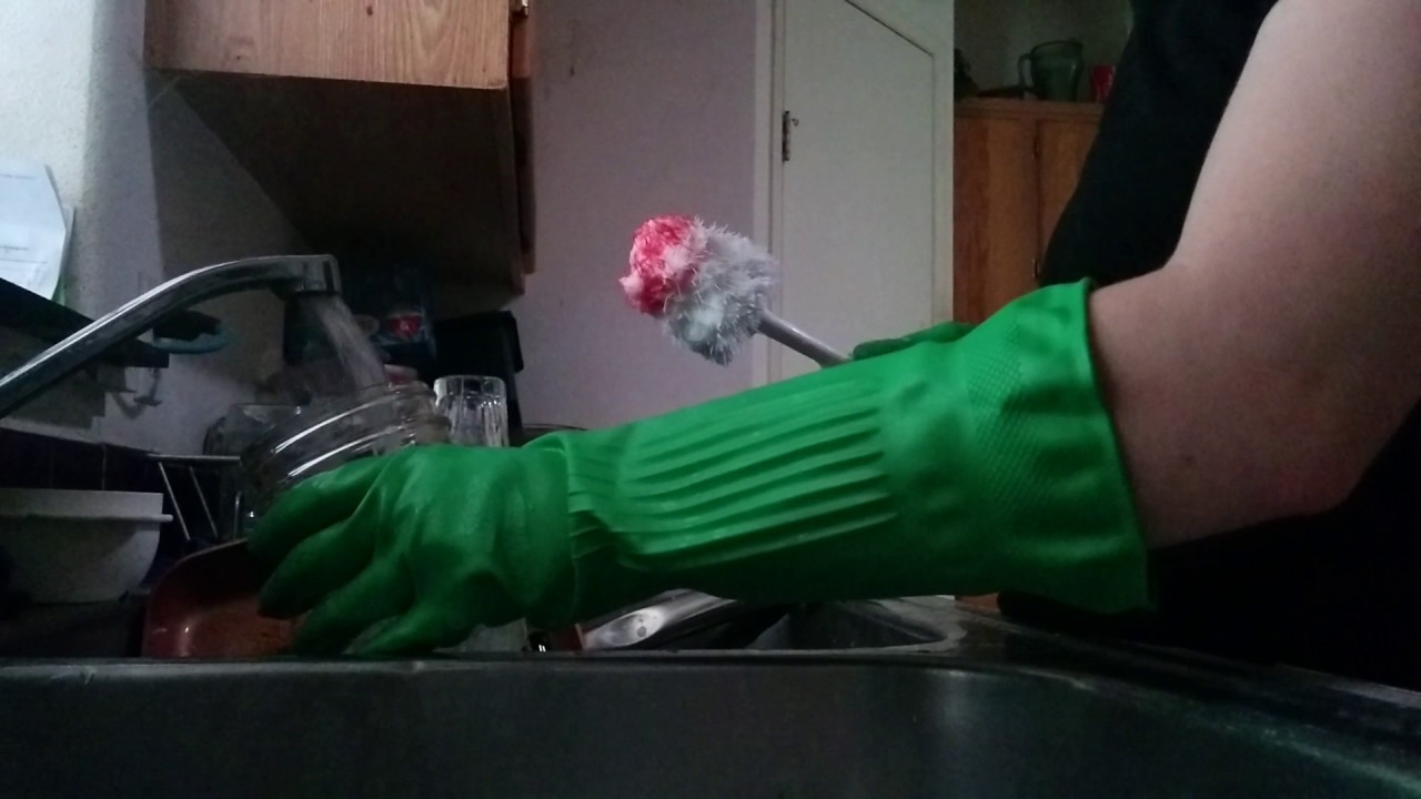 Washing dishes in green Playtex Living gloves!