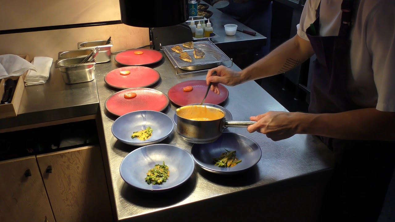 Busy kitchen service at 1 Michelin star restaurant Ikoyi in London, United Kingdom