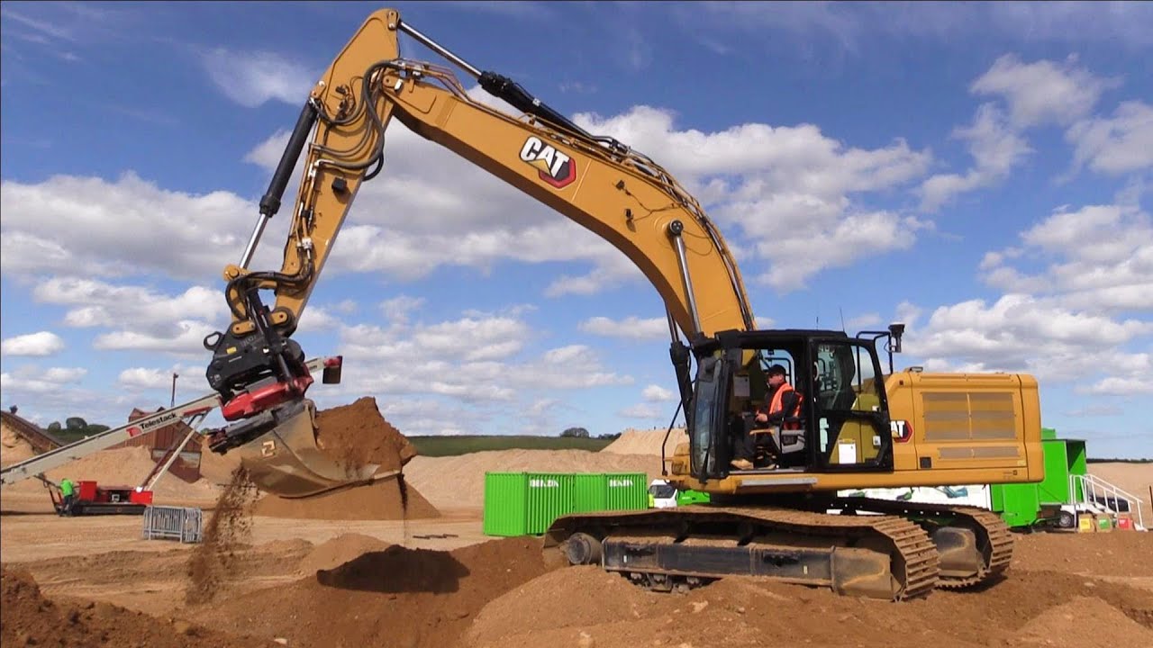 Cat 340 NextGen Excavator Equipped With An Rototilt Tiltrotator Throwing Gravel