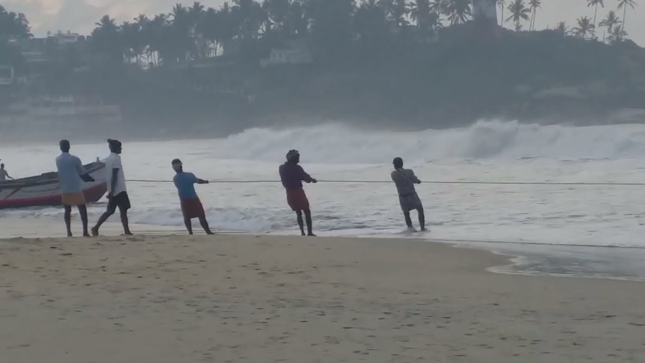 Tjaša Iris: LOCAL MEN PULLING IN GIANT FISHING NET, KOVALAM BEACH, KERALA, INDIA