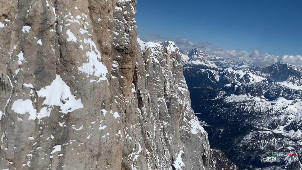 Breathtaking Gliding Flight over the sheer slopes of Marmolada Glacier and Dolomites Mountains