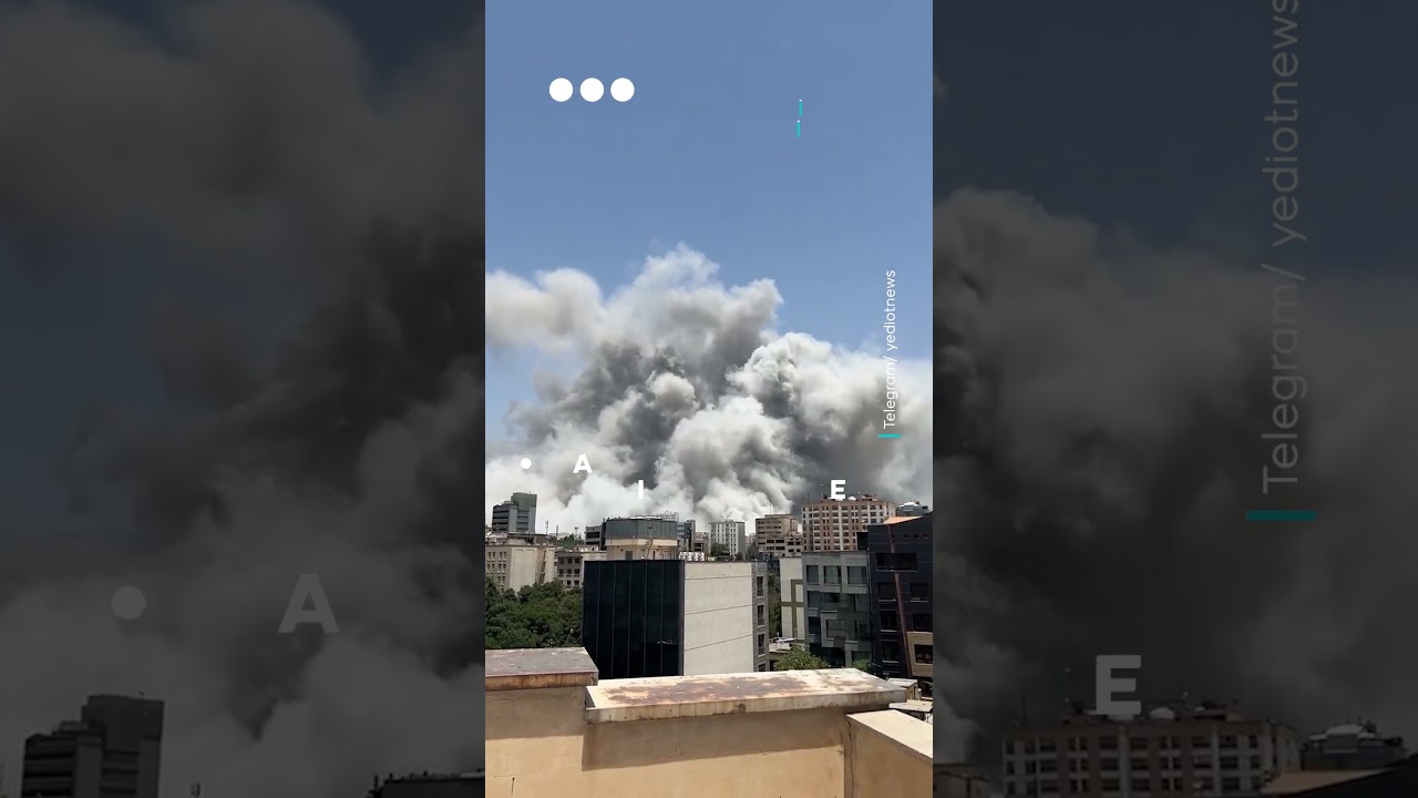Massive smoke cloud over Tehran skyline following Israeli strikes