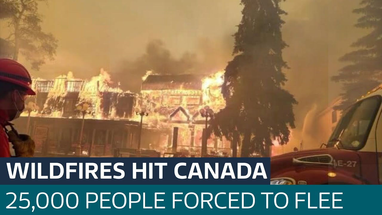 Fast moving wildfires force 25,000 to evacuate historic Canadian town | ITV News