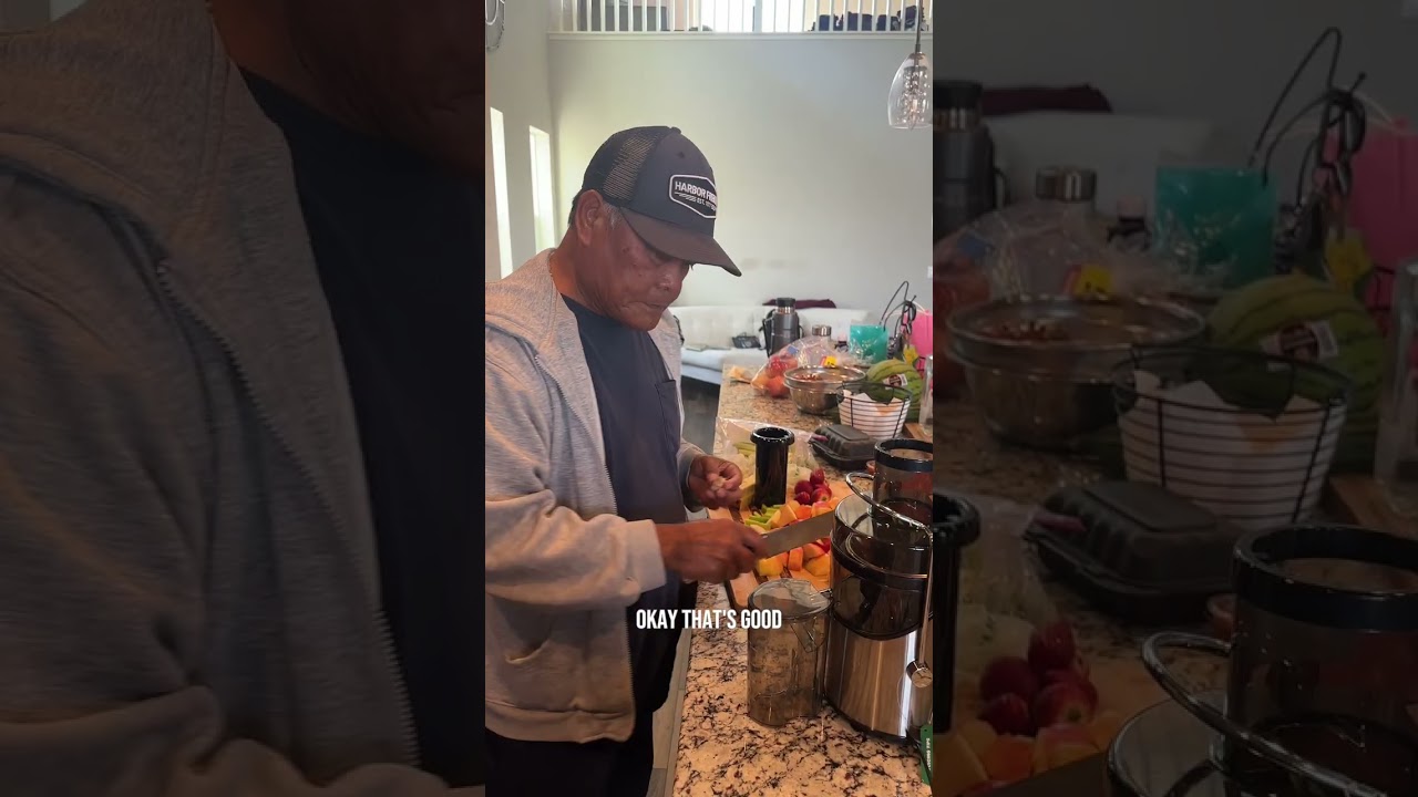 Papa Nelson using his new kitchen gadget - a juicer. Makes ginger, cilantro, apple, strawberry juice