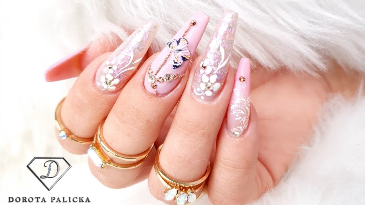 Doing my nails with not dominant hand. Pink nails with glitter encapsulation & butterfly. Fiber Gel