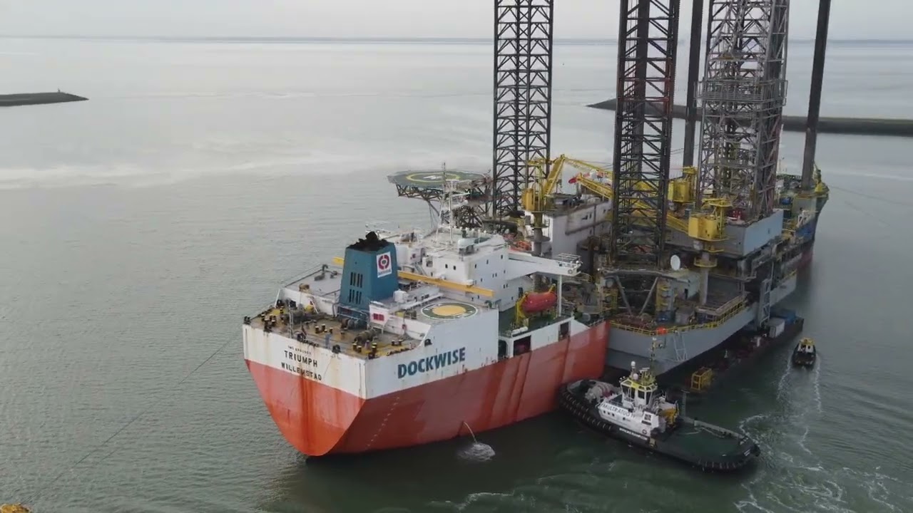 the Triumph Heavy lift Vessel with 2 work platforms the Atwood Aurora and Sianna in Vlissingen