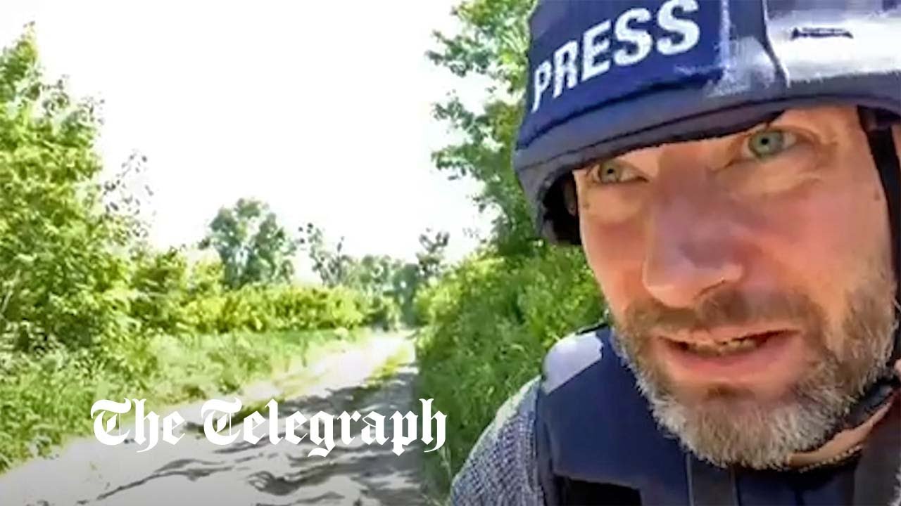 Telegraph correspondent forced to stop filming as Russians return fire over river near Kharkiv