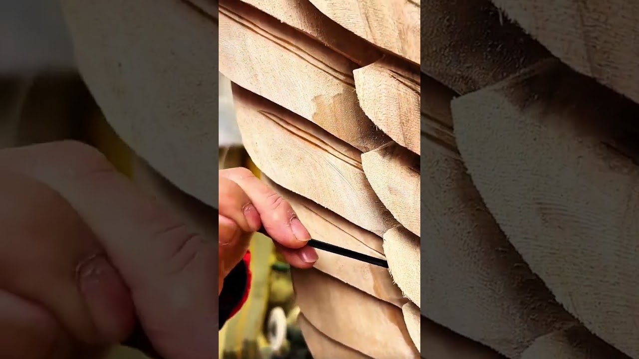 carving spiral groove into light wood with black tool
