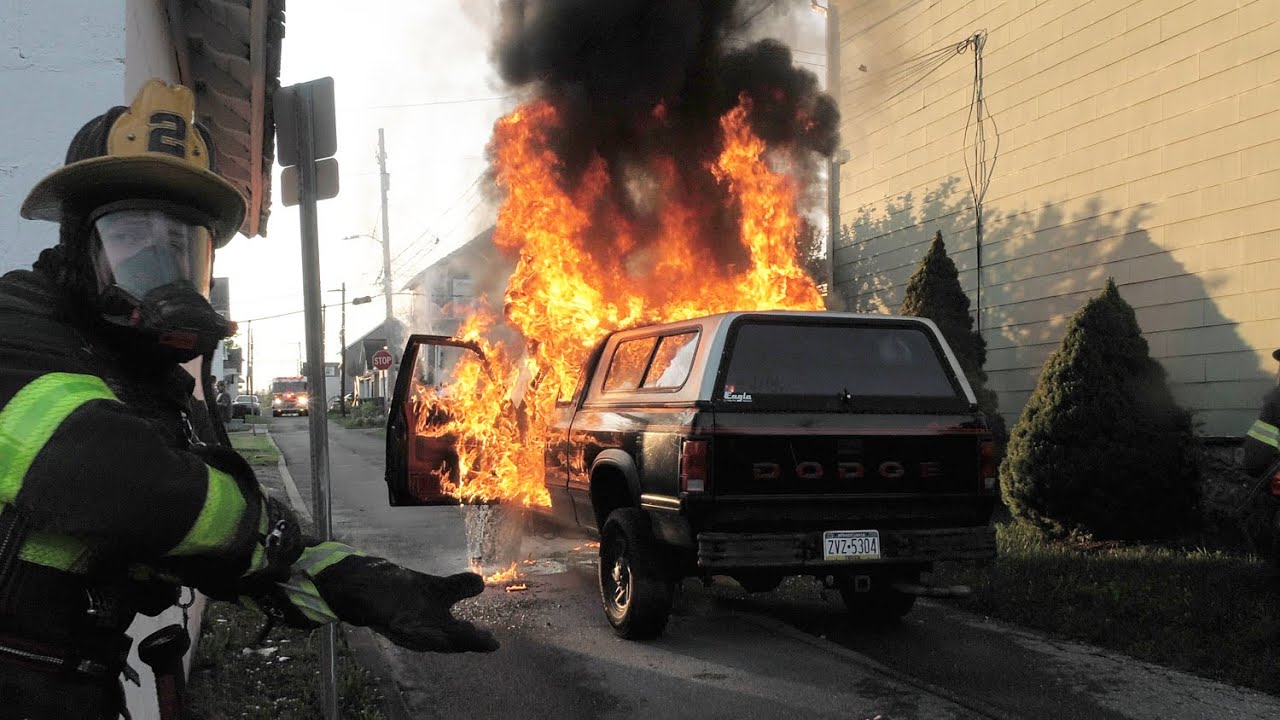 Dodge Pick-up truck fire threatens house