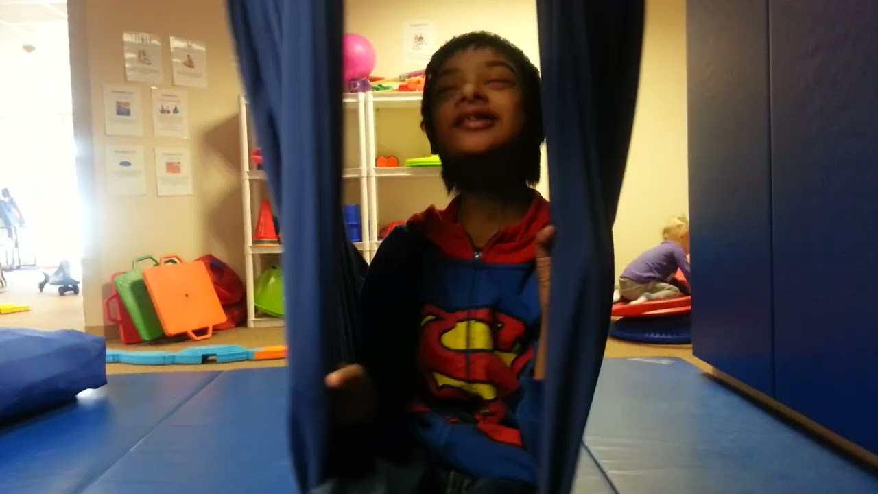 Sensibility Gym! Wonderful place for children with Autism!! Siddu enjoying sensory swing.