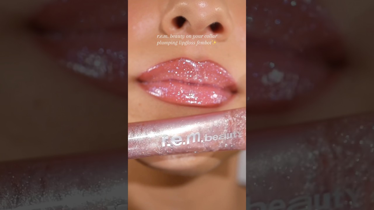 Juicy, sparkly, and so plumping!✨ ​⁠@r.e.m.beauty On Your Collar Plumping Lip Gloss in Fembot💫