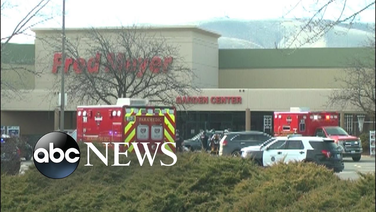 1 dead in shooting at grocery store, suspect at large