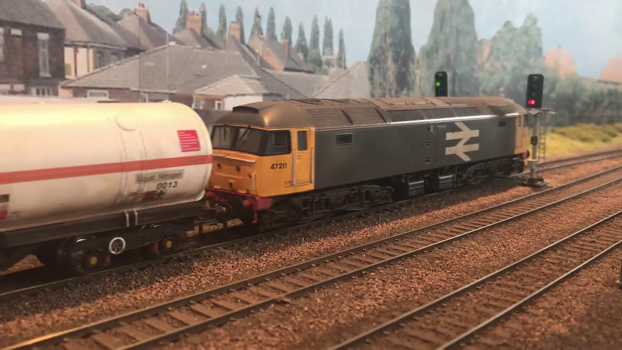 Waverley West Class 26s and 47211 on a rake of BOC bogie tank wagons