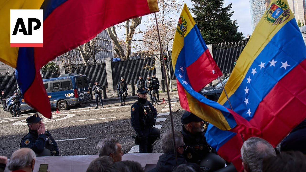 Protest outside US embassy in Spain against US actions in Venezuela