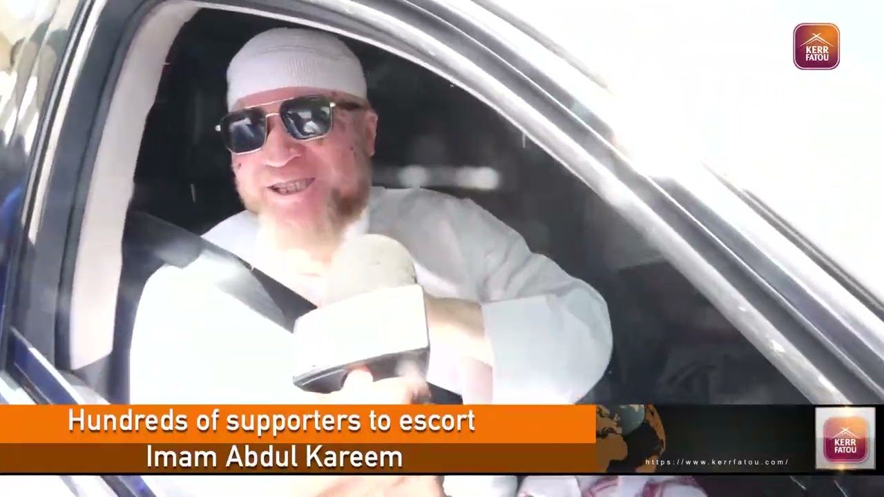 Hundreds of supporters gathered to escort Imam Abdul Kareem to the police headquarters.