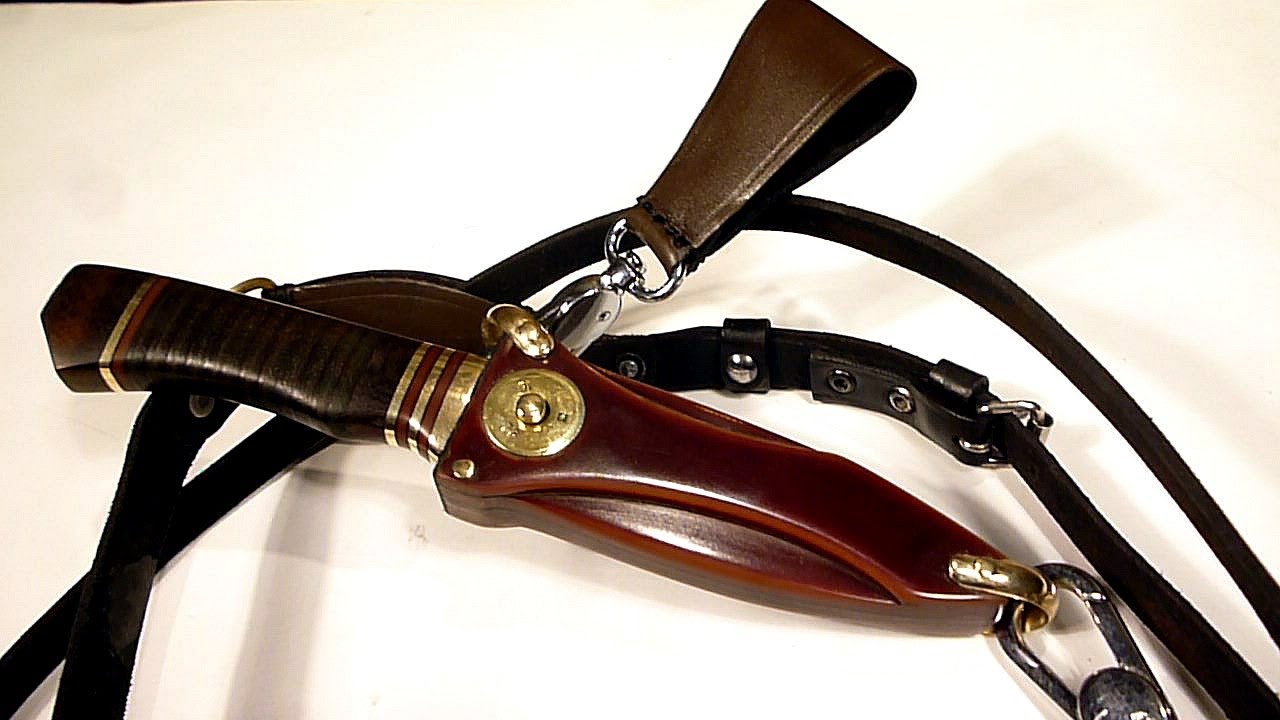 Ножны с кнопкой и универсальным подвесом.  Sheath with lock and universal suspension.