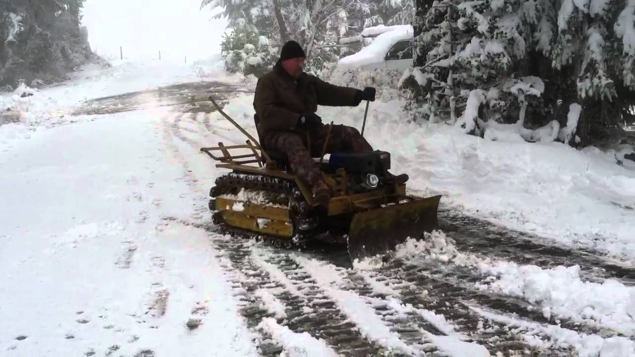 1947 Agricat clearing snowplow berm.