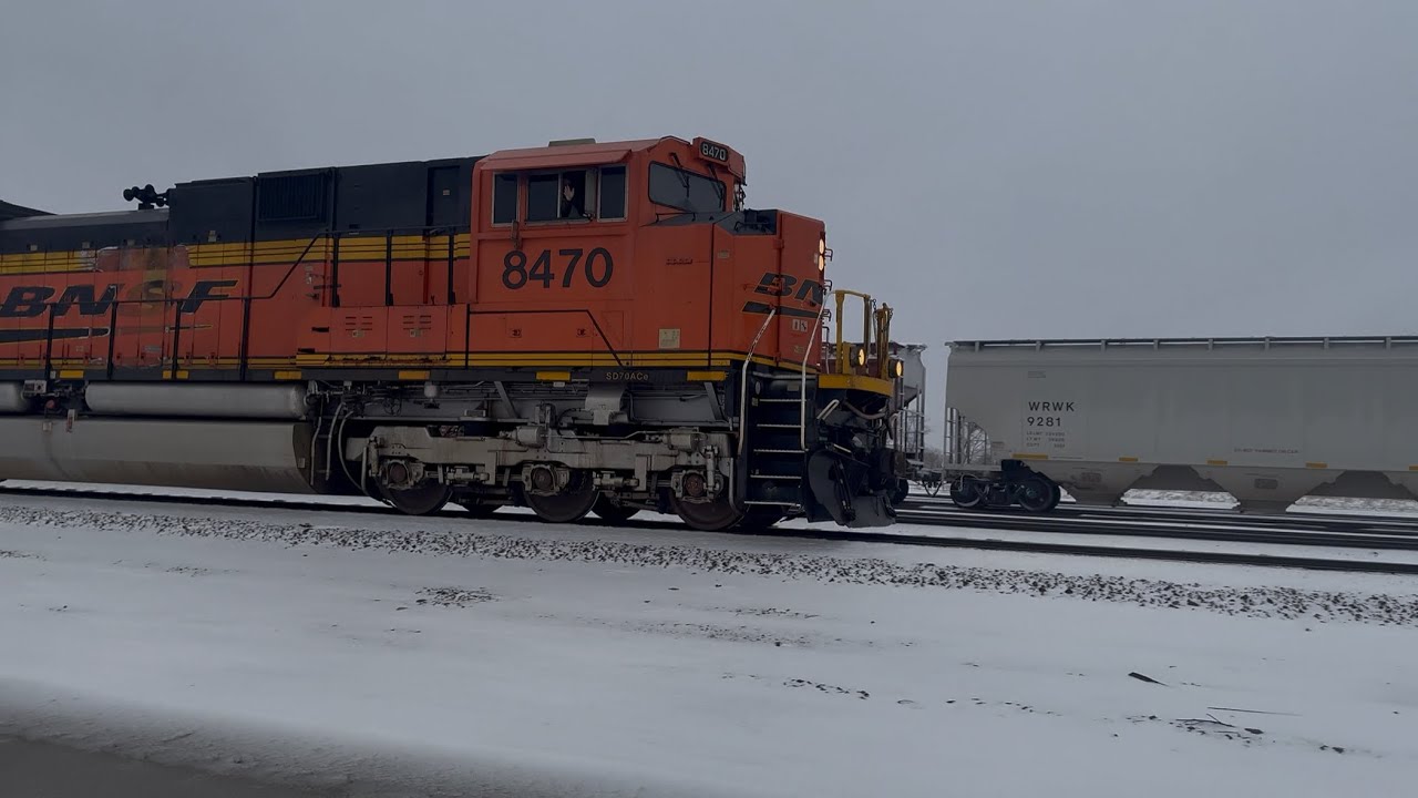 BNSF #8470 leads this empty Becker coal with friendly engineer. BNSF #9045 & BNSF #5712 