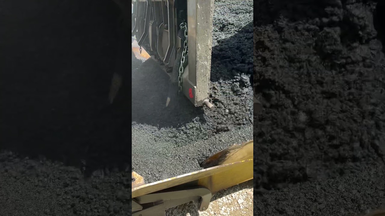 Hot asphalt into the paver. #work #asphalt #construction