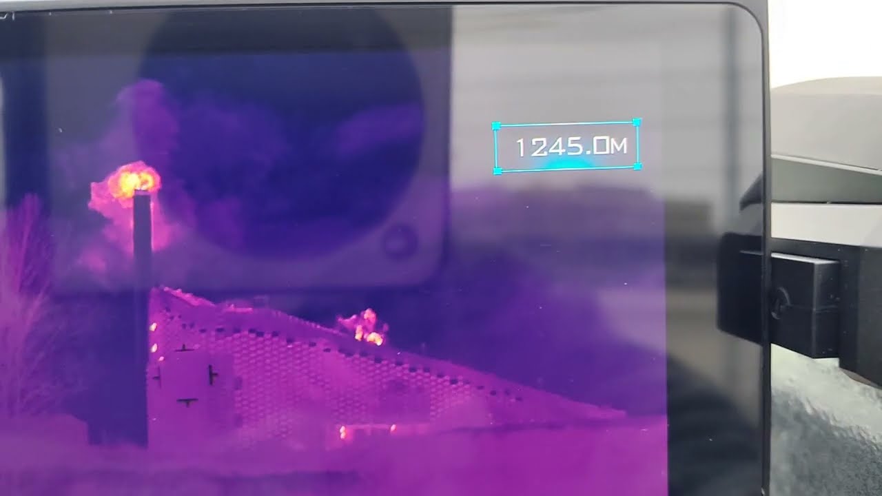 Raytron handheld thermal camera - IR laser rangefinder on a ski slope