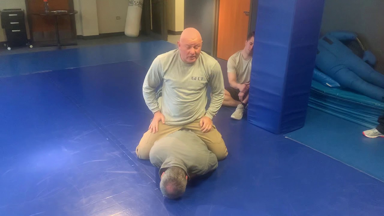 Leg kick over/ to handcuffing position/ to head scoop handcuffing method