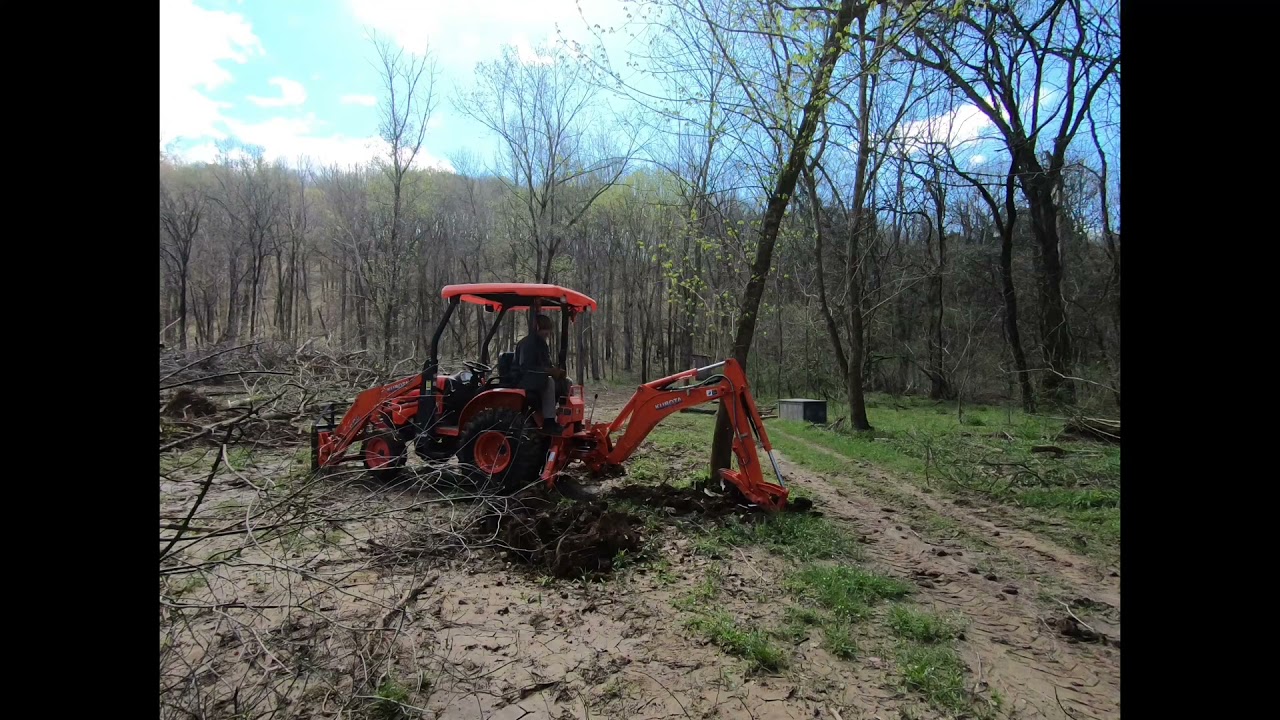 Kubota B26 clearing trees