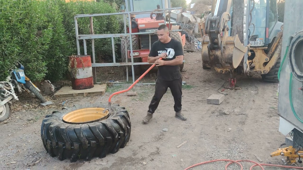 reparación rueda retroexcavadora