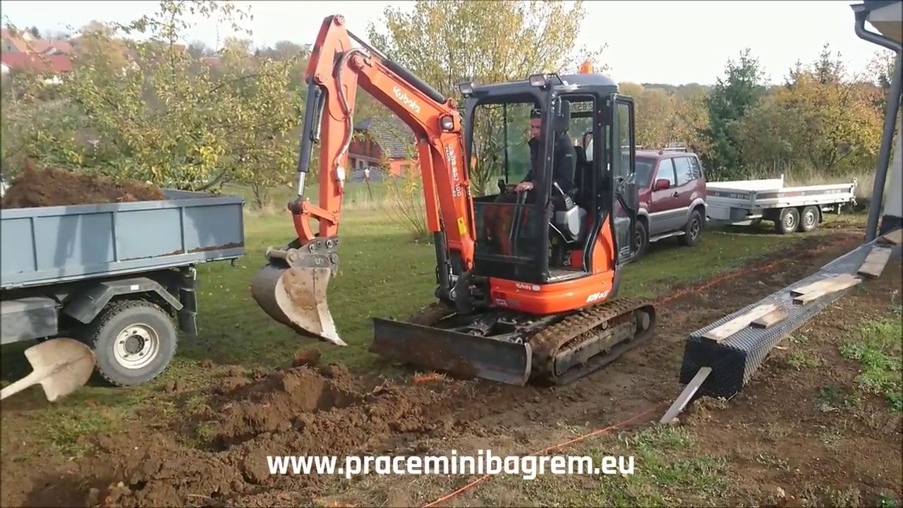 Kubota U20 - loading Multicar & trailer