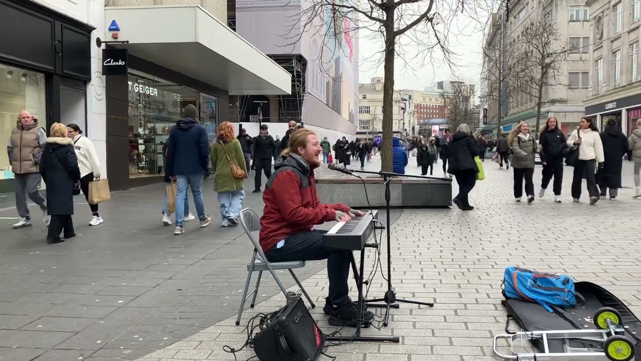 Street busker Alex - sings rocket man on church street Liverpool