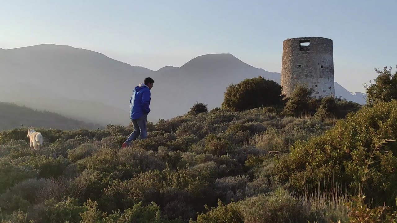 Mytilinoi: crossing the big stone bridge to the water basin and the old windmill