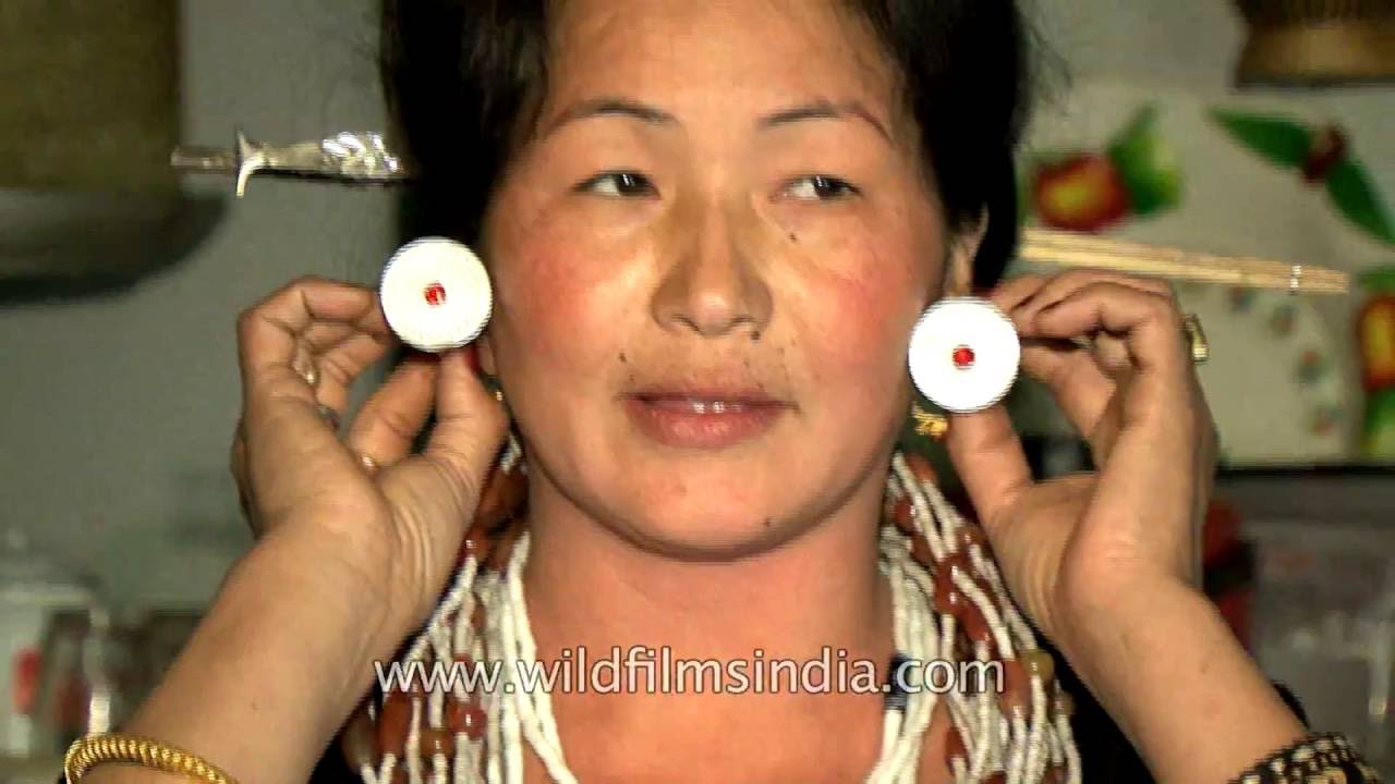 Idu Mishmi woman shows her traditional jewellery and dress