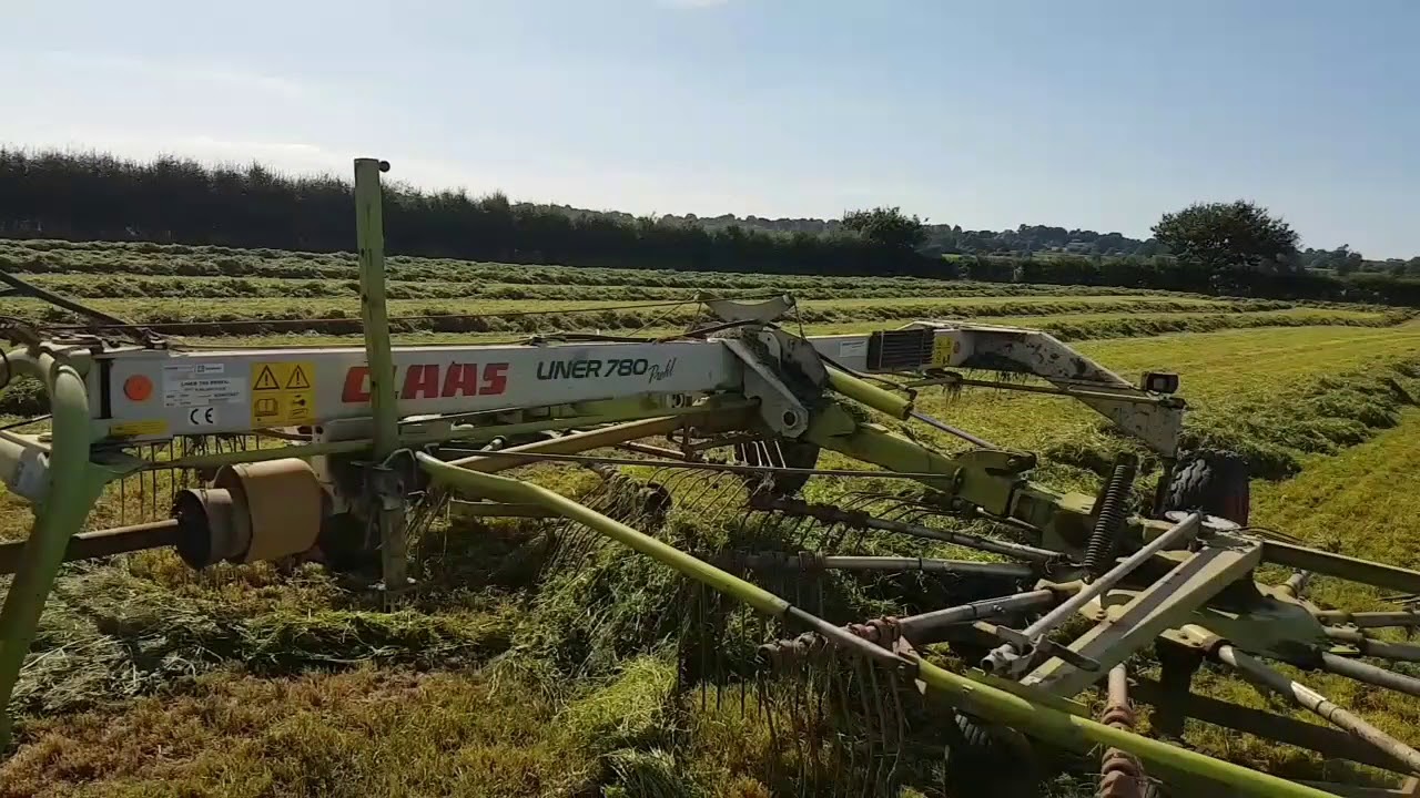Massey 8120 raking and mowing into the night