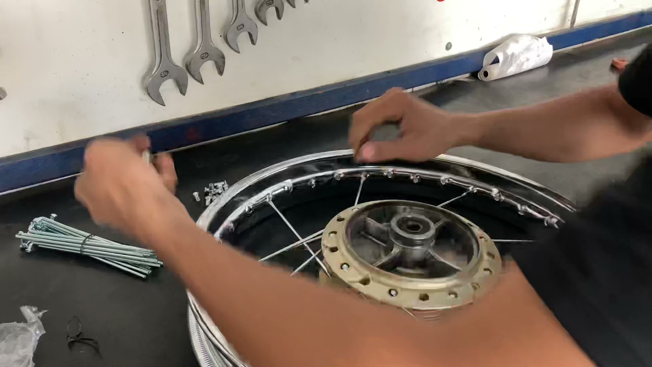 Como montar roda titan 150/125 raios de moto