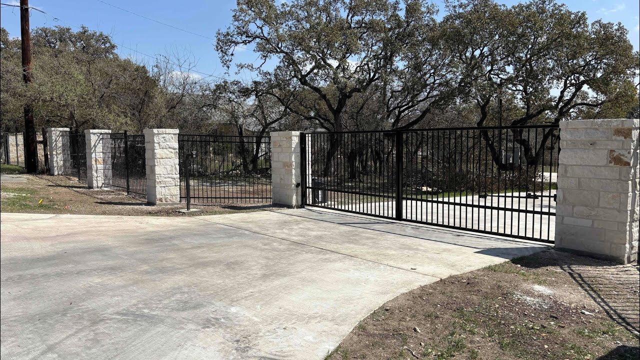 Steel  fence with stone columns build