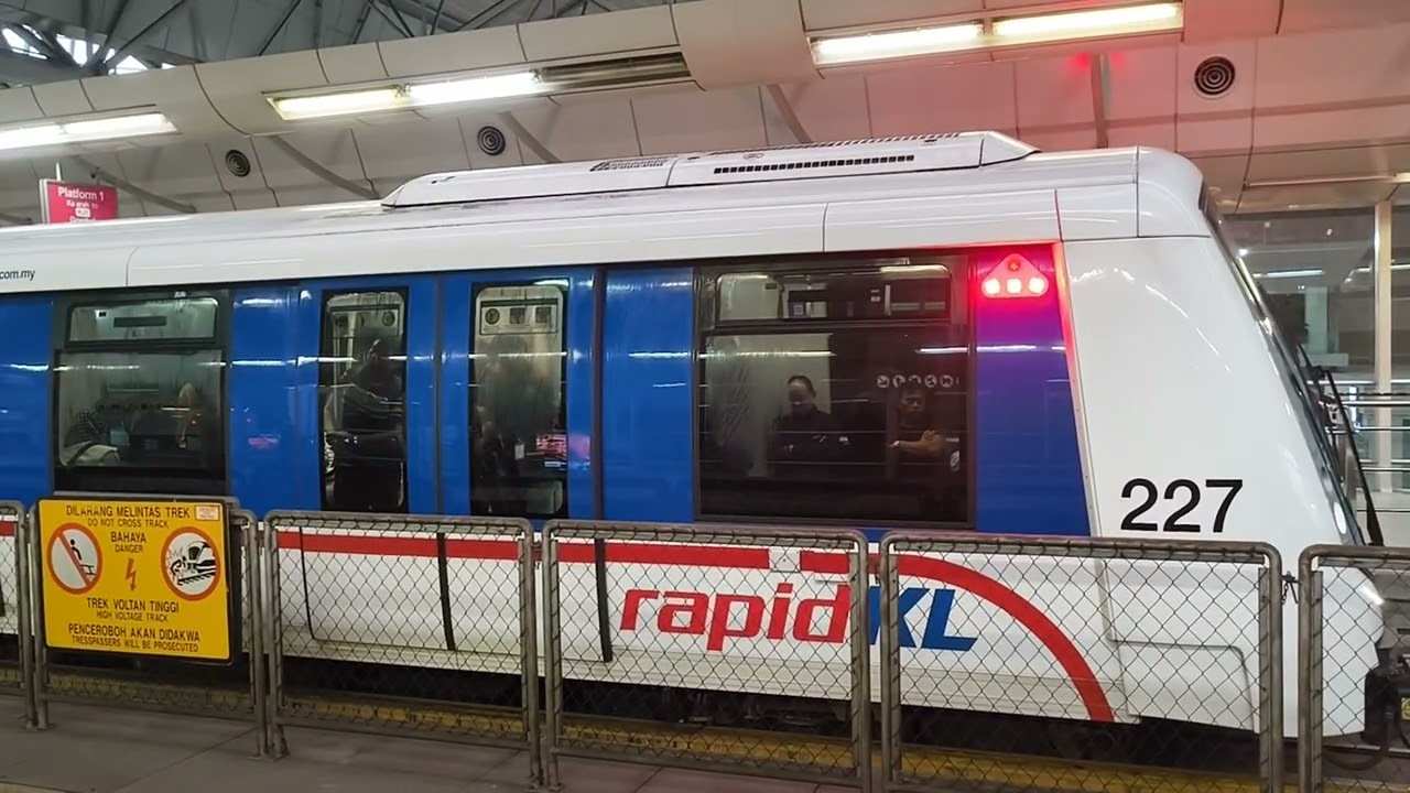 LRT Kelana Jaya Line Alstom Innovia Metro 300 (set 27) arriving and departing at KL Sentral.