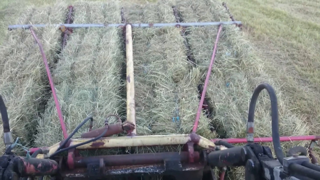 Rebuilt MF 205 , pickin some haybales with homemade grapple