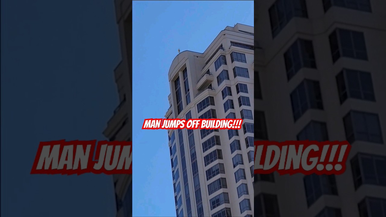 Man jumps off building! #shorts #caughtoncamera #basejump