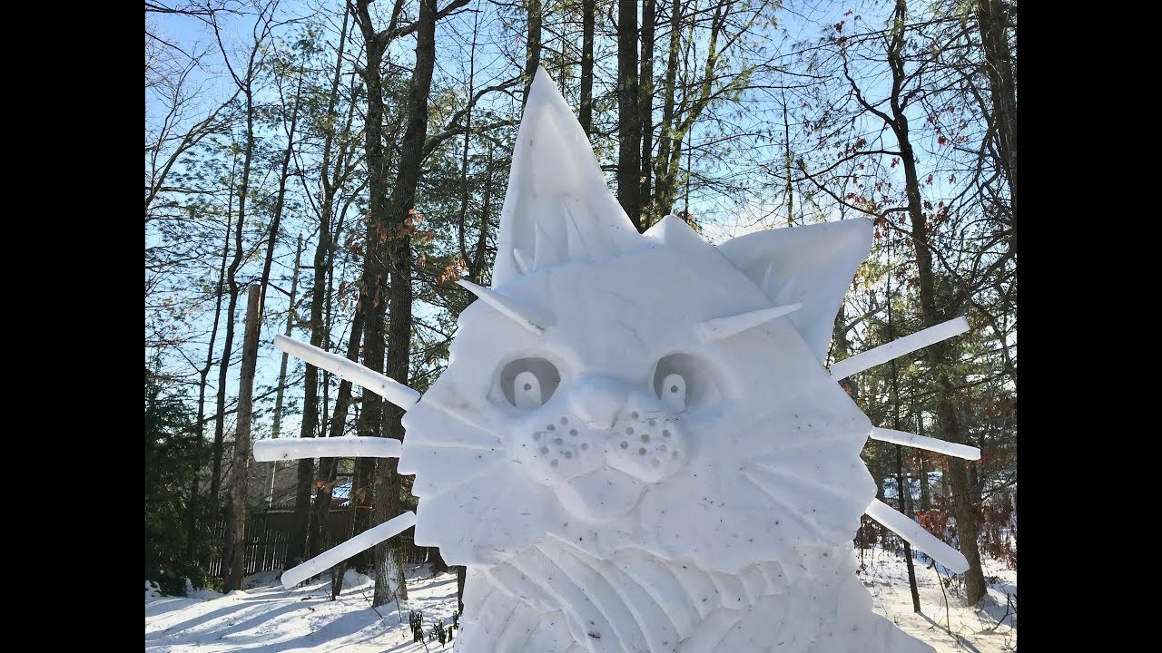 View an 8-foot cat sculpture made from 3,000 pounds of snow