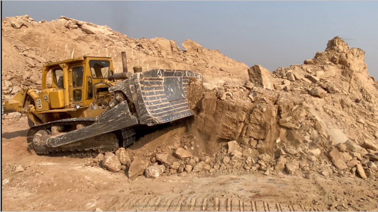 CAT D8k Dozer Cutting Hard Mountain
