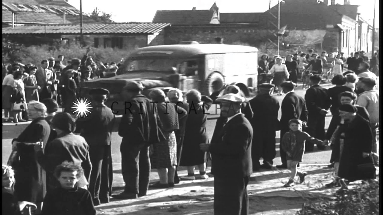 French civilians watch and give flags to US 2nd Armored Division, 745th Tank Batt...HD Stock Footage