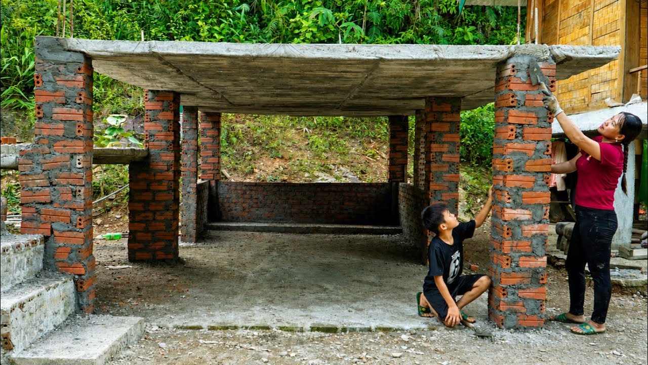 A woman and her 7-year-old son build brick and cement pillars | Chuc Thi Hong