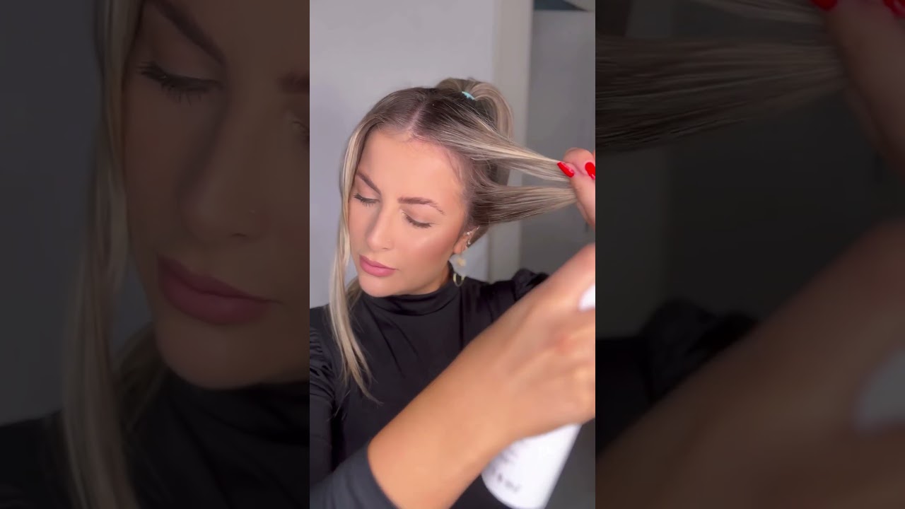 Penteado rabo alto repartido no meio