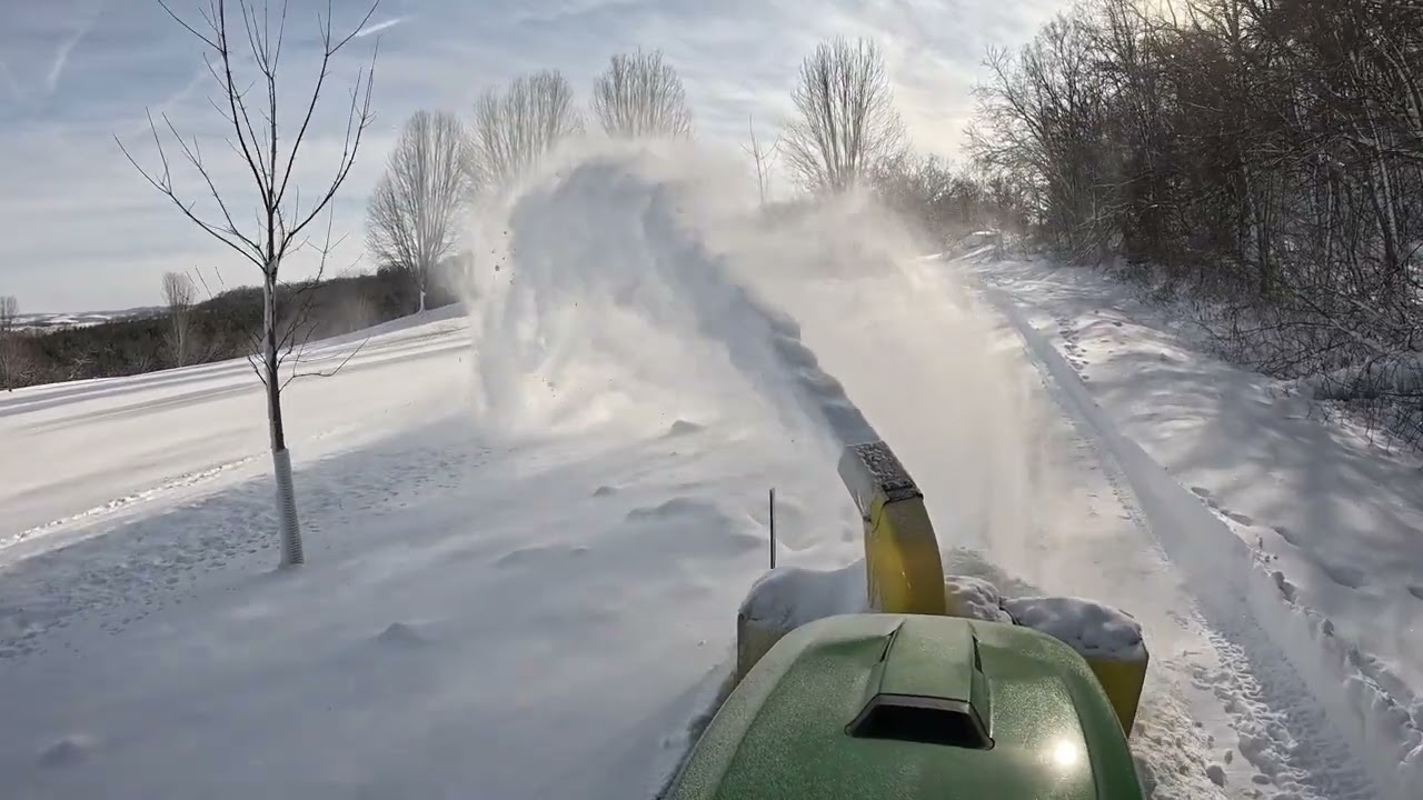 John Deere X758 snowblower attachment, plowing 200 yards of deep snow.