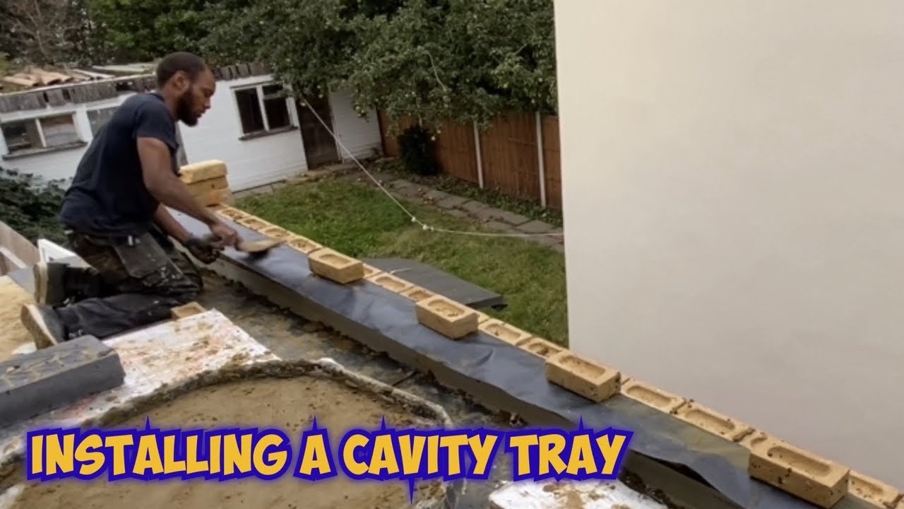 Installing a cavity tray in the parapet wall