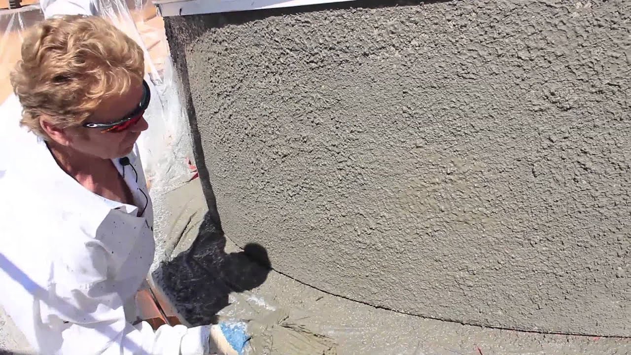 Pebble dash stucco finish on a turret.